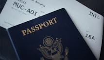 passport booklet on top of white paper
