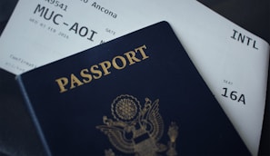 passport booklet on top of white paper