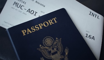 passport booklet on top of white paper