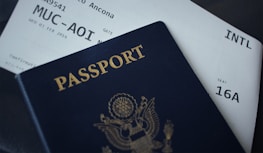 passport booklet on top of white paper