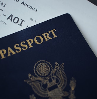 passport booklet on top of white paper