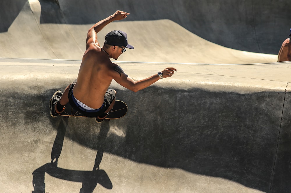 man riding skateboard doing trick outdoor
