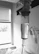 A professional medical technician administering IV therapy in a sleek hotel room.
