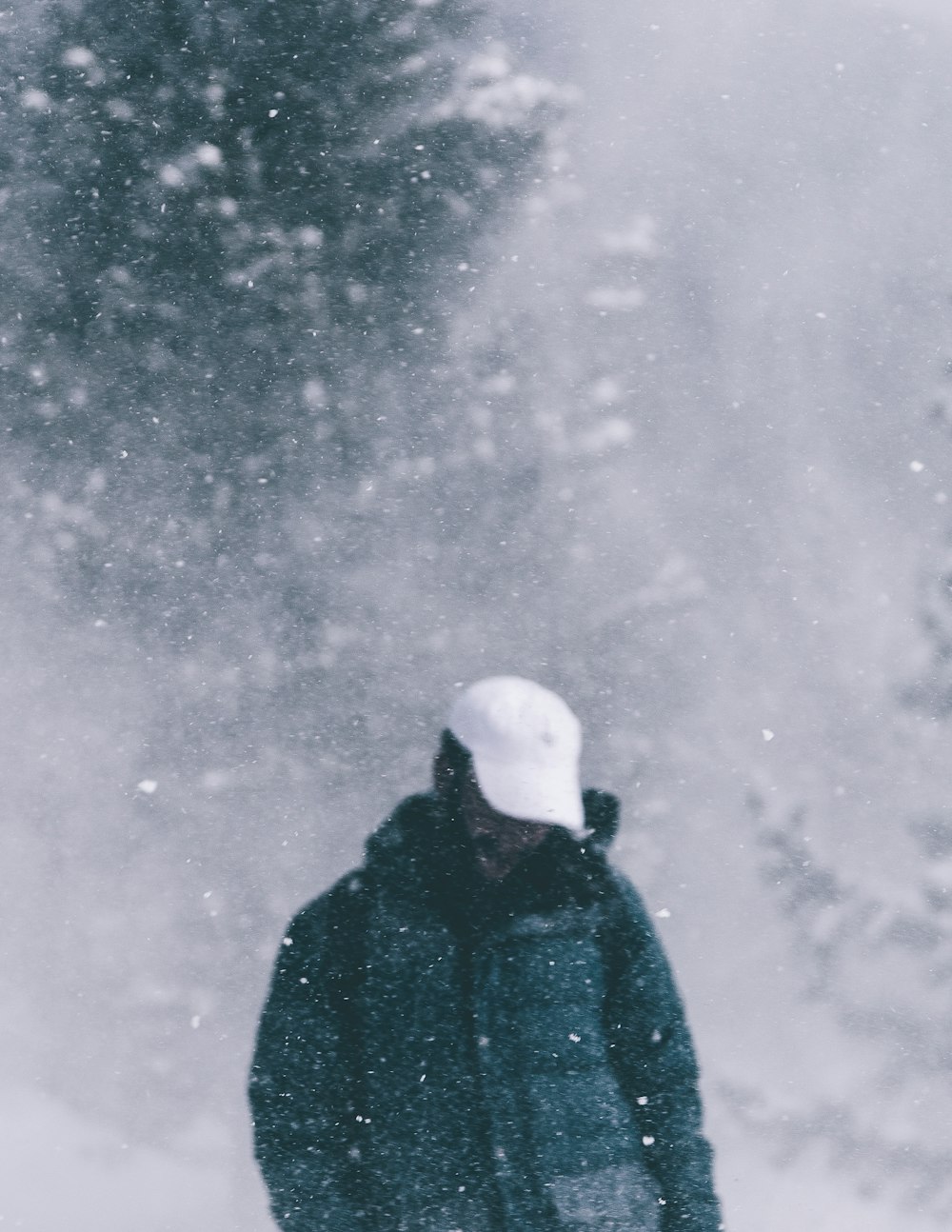 man wearing black snowsuit during winter