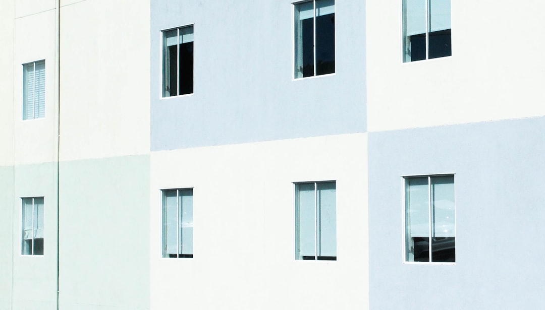 white and gray concrete wall with windows