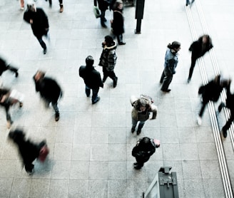 people walking on grey concrete floor during daytime