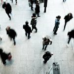 people walking on grey concrete floor during daytime