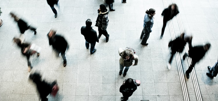 people walking on grey concrete floor during daytime