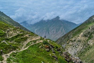 person standing on gray mountain