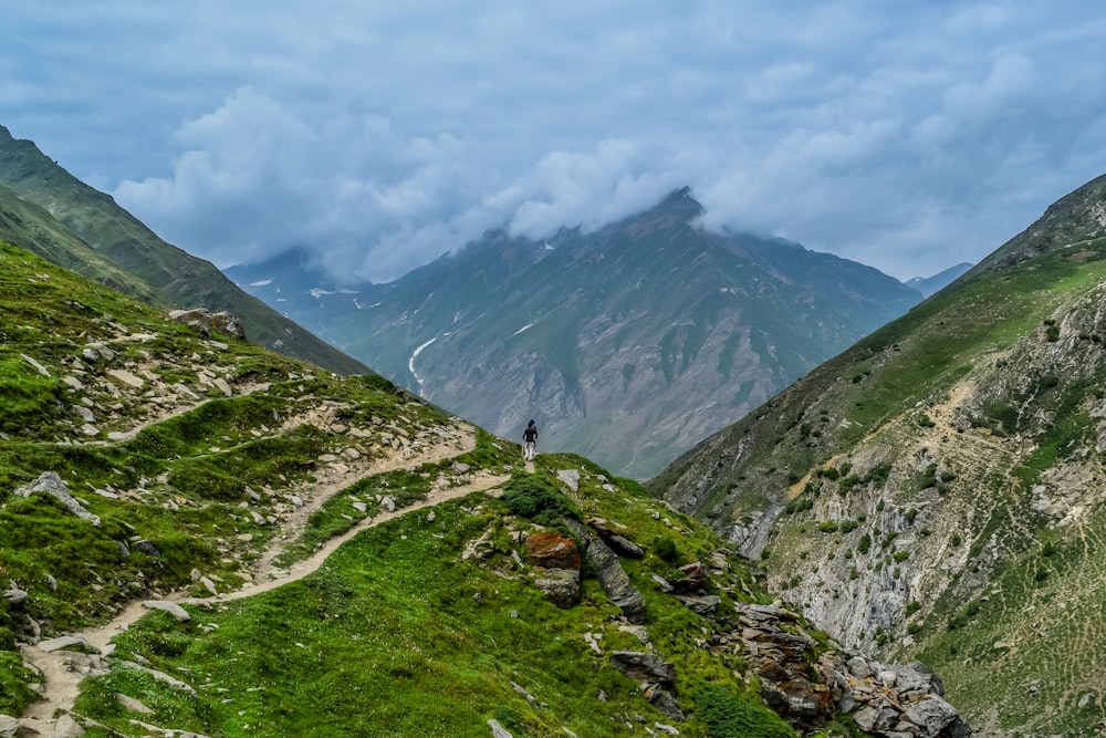 person standing on gray mountain