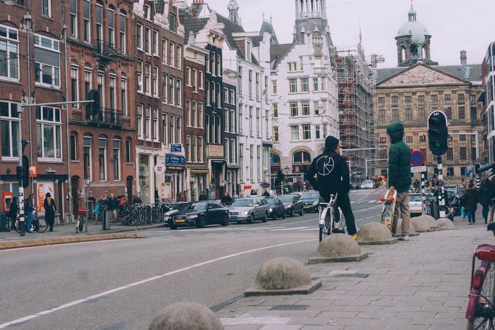 two men standing beside street