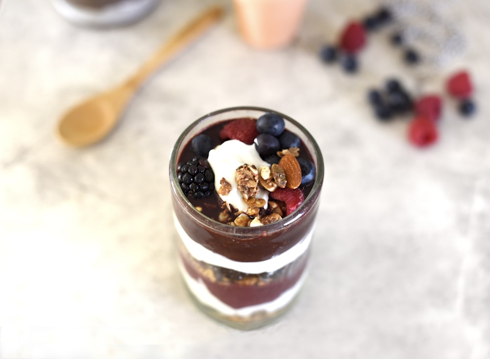 selective focus photography of fruit desert on glass container