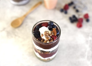 selective focus photography of fruit desert on glass container
