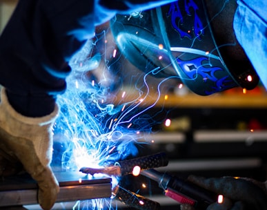 man holding gray steel frame