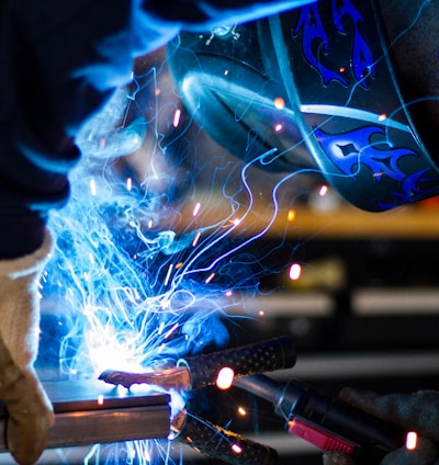 man holding gray steel frame