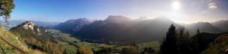A panoramic view of the lush Alpes-Maritimes mountains with sunlight highlighting the natural landscape.
