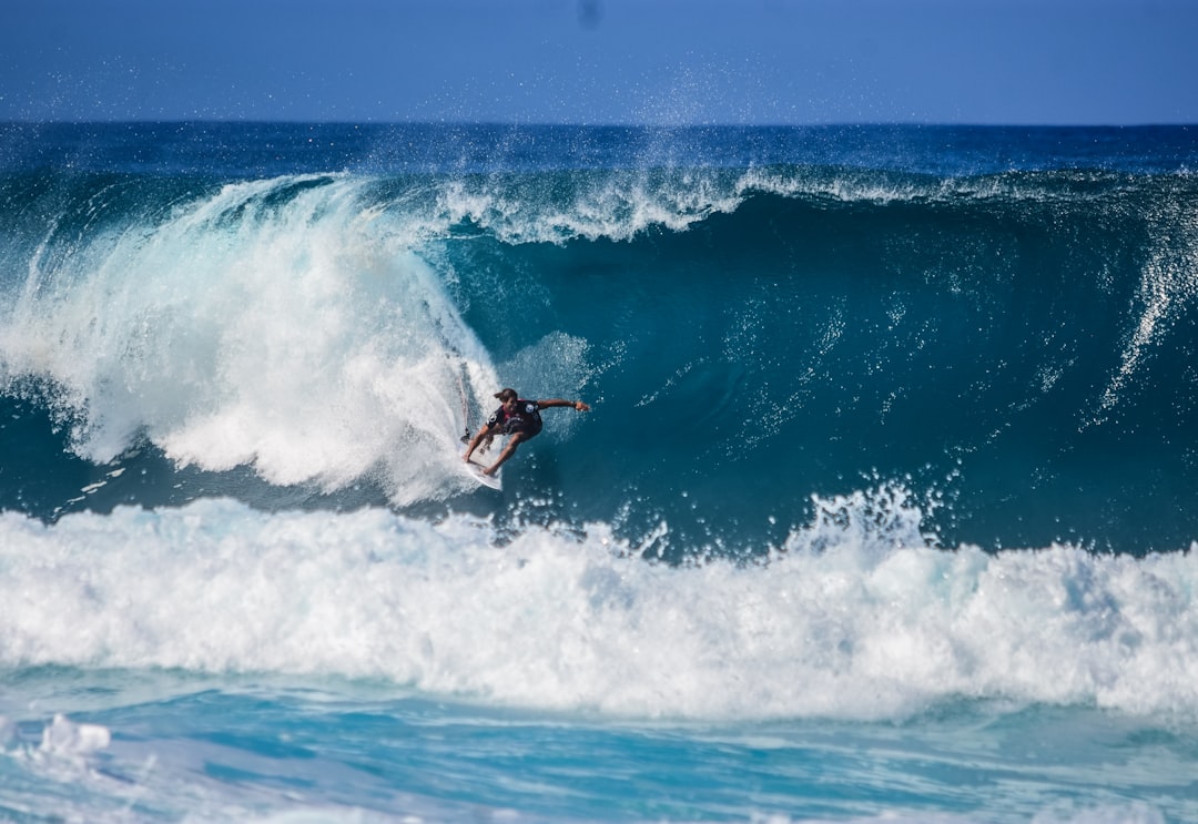 person surfing on wave, Riding the blue sea