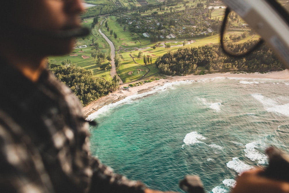 photo of seashore near trees