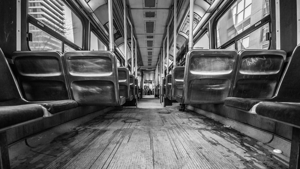 grayscale photograph of inside of train