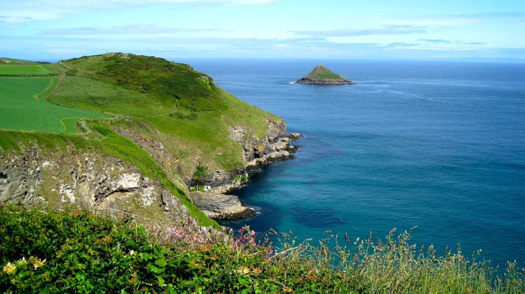 cliff near seashore at daytime