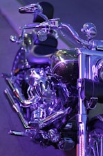 Close-up of a motorcycle being carefully detailed with red and black accents.