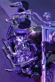 A close-up of a polished motorcycle reflecting light.