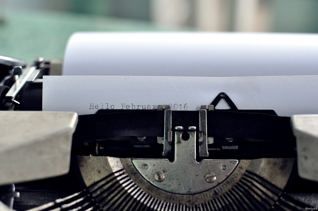 paper on typewriter showing Hello February 2016 text, Macro typewriter ribbon