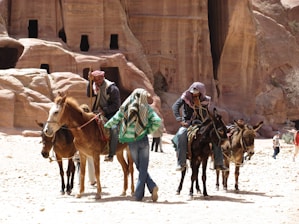 Tourists riding donkeys and camels through the scenic countryside near Akermoud.