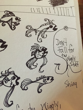 A whimsical drawing of a fish riding a bicycle on a tightrope.