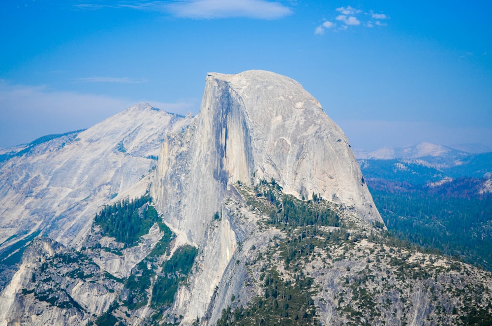 aerial view photography of mountain under cloudy sky