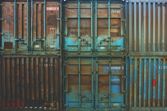 six blue freight containers