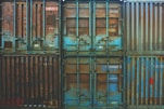 six blue freight containers