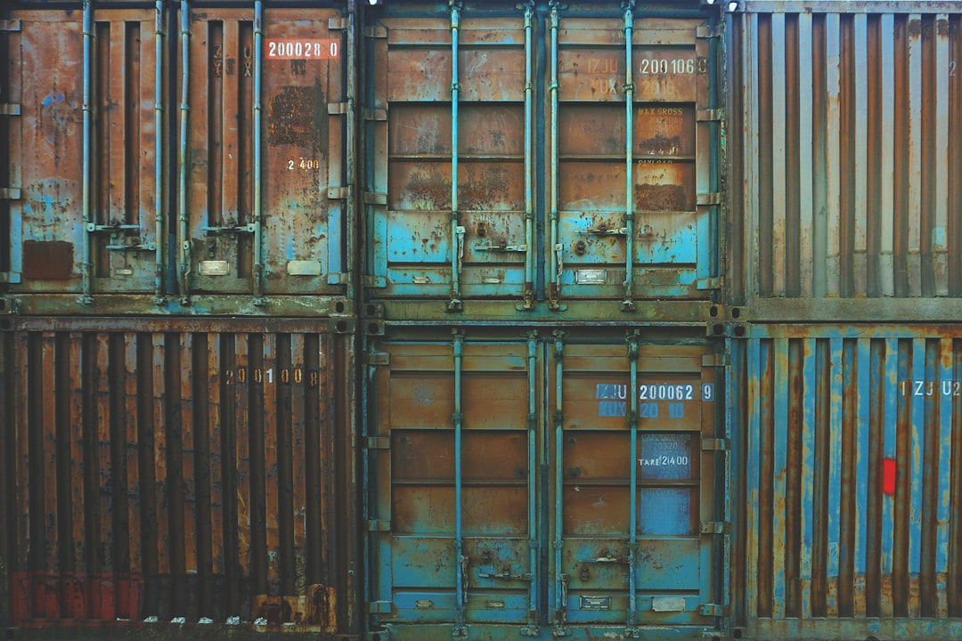 six blue freight containers,