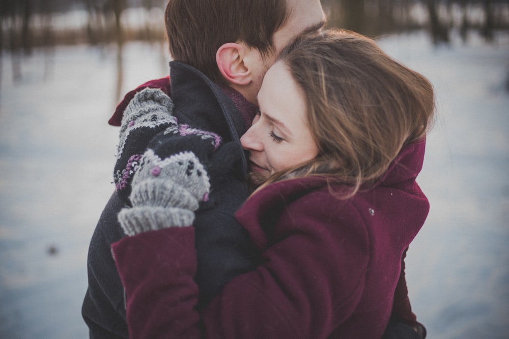 man and woman hugging each other