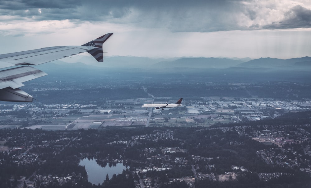 white and red airplane flying