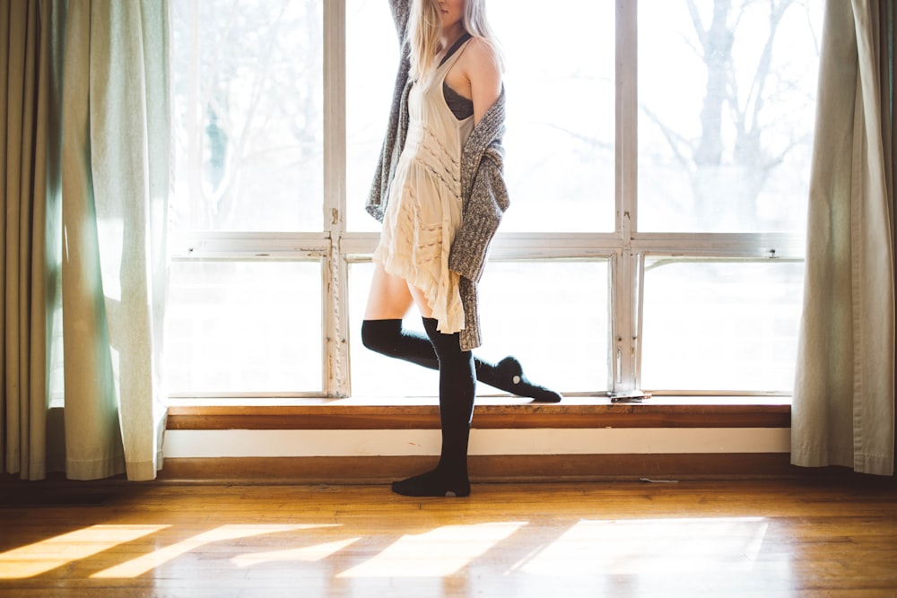 person standing beside window