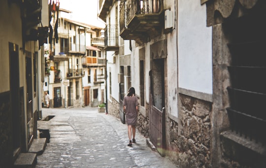 girl walking along pathway in Candelario Spain