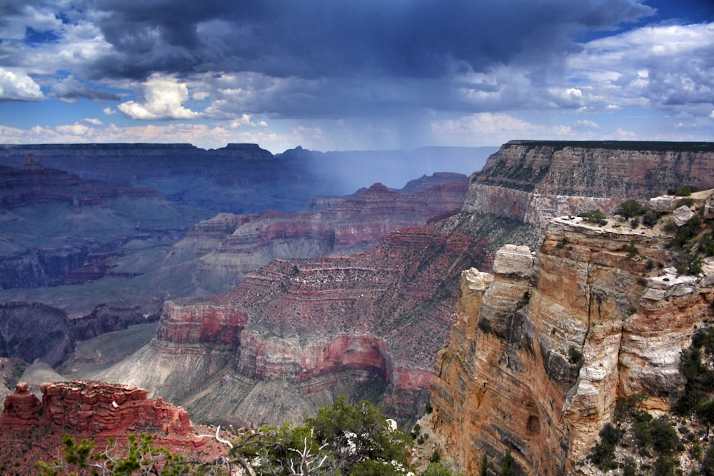 brown and gray rocky mountain under cloudy sky