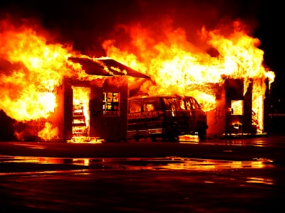 flaming house and vehicle during daytime fire google meet background