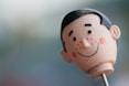 selective focus photography of doll head