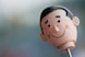 selective focus photography of doll head