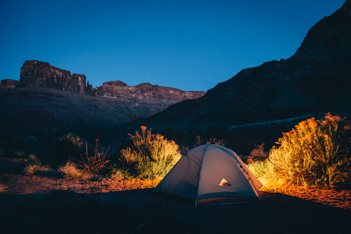 True 4-season mountaineering tent pitched on snowy alpine ridge