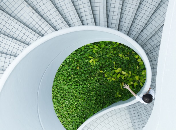 woman standing spiral stairs