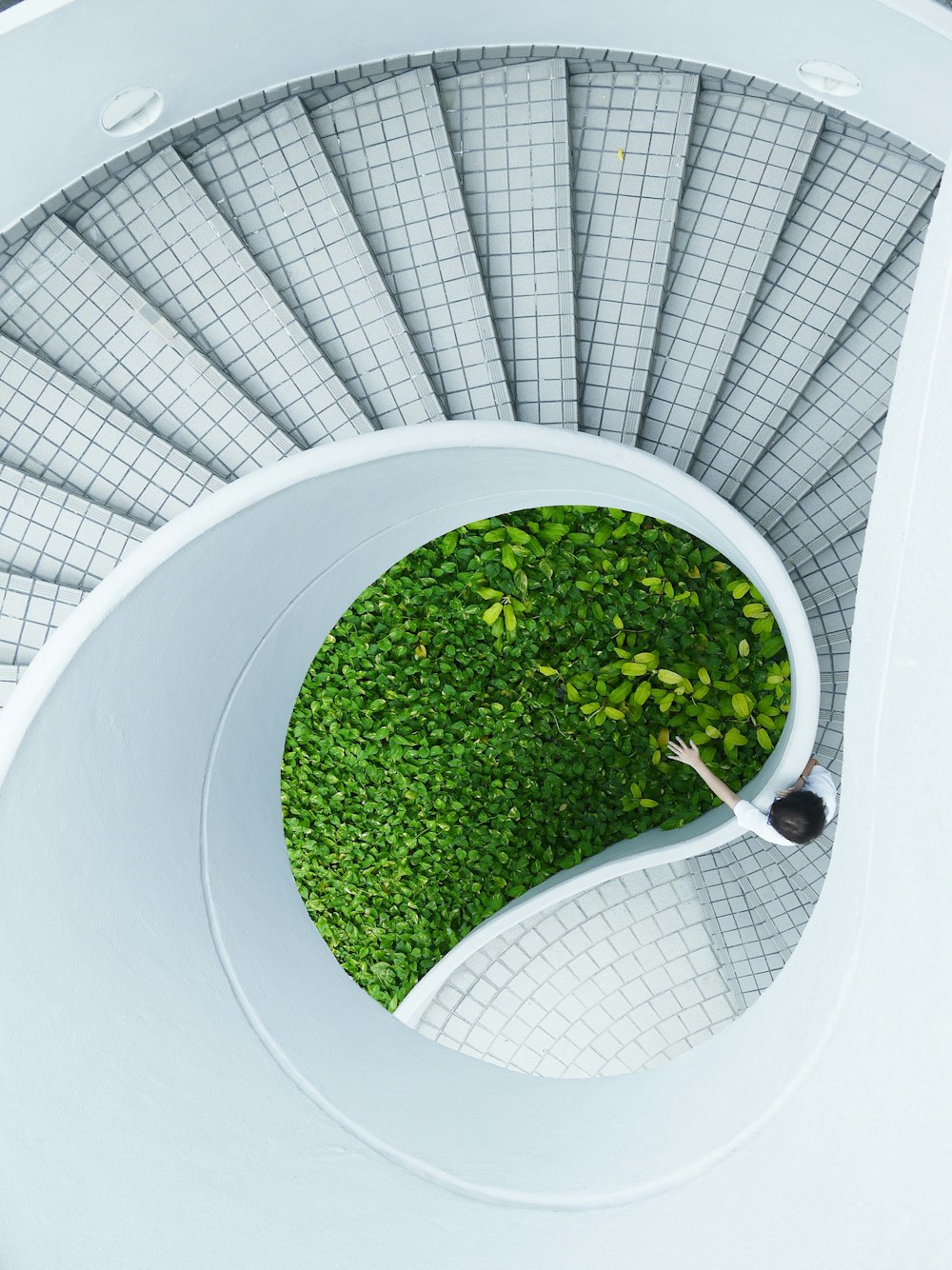 woman standing spiral stairs