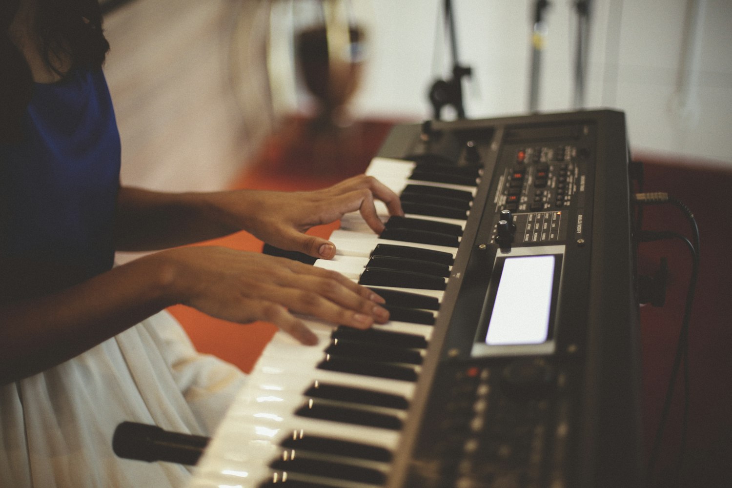 Woman is playing the Roland FP-30 Digital Piano