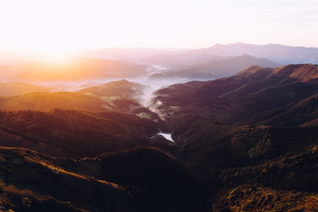 aerial photography of mountain and river view during daytime