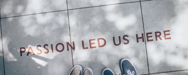 two person standing on gray tile paving