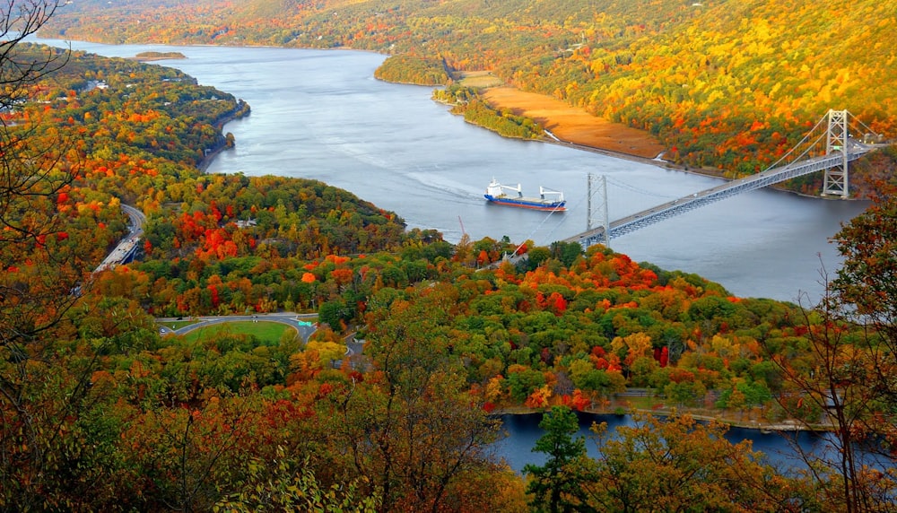 aerial photo of bridge and boat between island