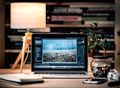 MacBook Pro on brown wooden table inside room