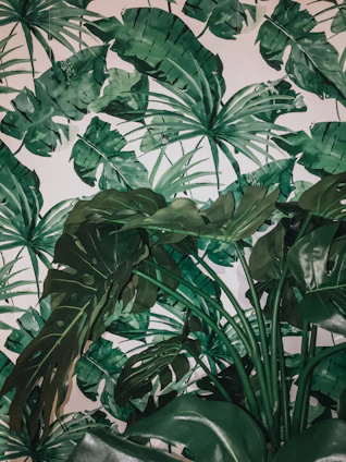 Luxurious green and gold themed botanical arrangement with floating leaves animation.